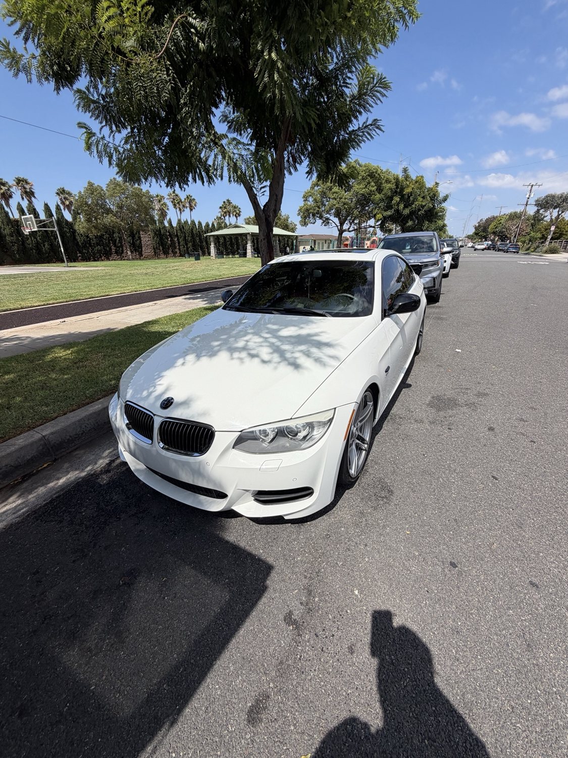 White BMW coupe parked outdoors after exterior detailing